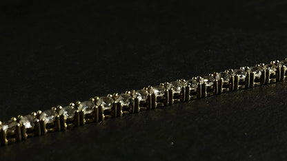 Dazzle and Shine: Elevate Your Style with our 18kt Gold Tennis Bracelet!