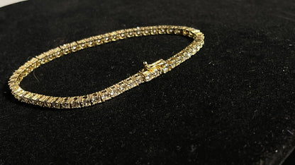 Dazzle and Shine: Elevate Your Style with our 18kt Gold Tennis Bracelet!