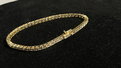 Dazzle and Shine: Elevate Your Style with our 18kt Gold Tennis Bracelet!