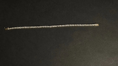 Dazzle and Shine: Elevate Your Style with our 18kt Gold Tennis Bracelet!